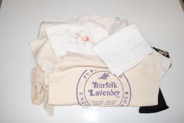 A bag containing table linen, ladies gloves etc.