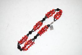 A sterling silver, red coral and black onyx neckla