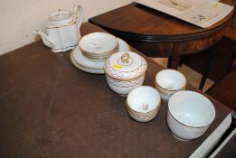 A 19th Century porcelain part tea set, similar dec