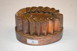 An antique copper jelly mould