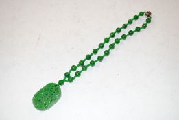 A carved jade necklace 105gms