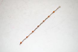 A vintage sterling silver and amber bracelet