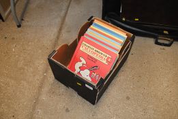 A box containing fifteen Charlie Brown books