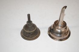A white metal wine funnel and one other funnel
