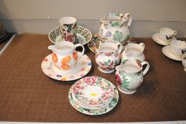 A quantity of various Emma Bridgewater jugs, plate