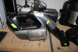 A G-Tech cordless vacuum cleaner, lacking charger,
