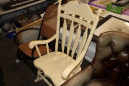 A painted slat back rocking chair