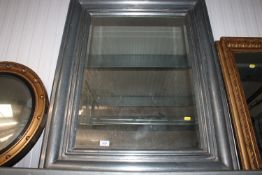 A metal framed and bevel edged wall mirror