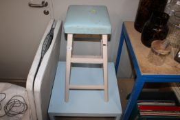 A blue painted side table together with a bar stoo