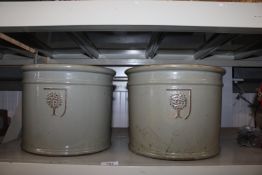 A pair of green glazed planters