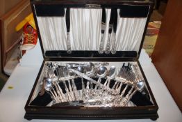 An oak canteen and contents of Community silver pl