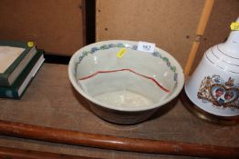 An Oriental famille rose decorated bowl with charac