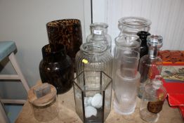 A quantity of various glass vases, jars etc.