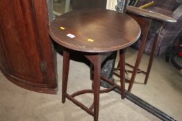 A mahogany circular side table