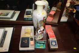 A bird decorated vase signed Mabelle Benson to base; a continental porcelain figure of a boy;