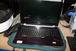 An HP Pavilion laptop and charger Sold as seen