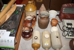 A quantity of various stone ware to include flagon