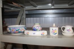 A quantity of various Poole pottery to include a pot and cover, vase, jug etc.