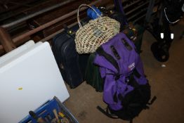 A Vango back pack 65litres; two suitcases; hockey