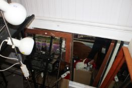 A white framed over mantel mirror together with tw