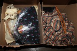Two boxes containing various clothing