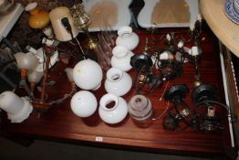 A quantity of various light fittings, glass lamp s