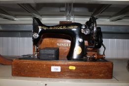 A Singer sewing machine in fitted wooden case