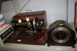 A Frister and Rossman sewing machine in fitted case together with an oak cased three hole mantel