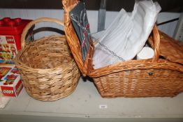 An Antler picnic set together with a wicker basket