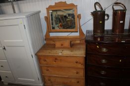 A stripped pine dressing chest fitted three drawer