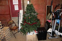 An artificial Christmas tree; a box of various Chr