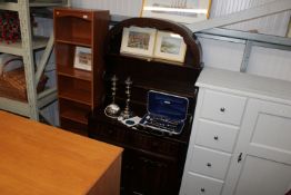 An oak 'Old Charm' style dresser raised on cupboar