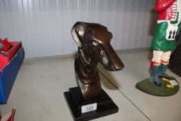 A reproduction ornament in the form of a greyhound