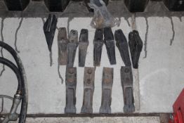 Quantity of unused digger bucket teeth.