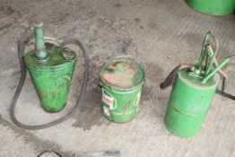 Two oil buckets and pumps.
