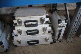 3x graduated carry cases and one other.