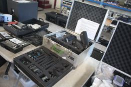 Quantity of Micron wireless microphones and accessories contained in a flight case.