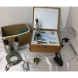 Plastic box containing five items - including two microscopes - Opax 2X,