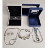 Four assorted Swarovski items including bracelet,