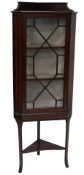 A 1920s Sheraton Revival inlaid mahogany corner display cabinet, with low gallery top, and canted
