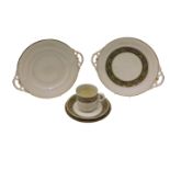 A Belleek Celtic design cup, saucer and plate, each with third mark, a two handled Celtic design