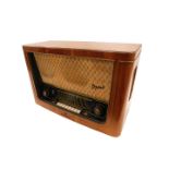 A vintage Telefunken valve radio, in a walnut case, 64cm wide.