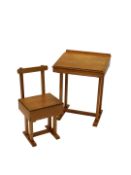 A beech and plywood child's desk and matching chair, the desk 51.5cm wide.