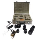 A Minolta XD7 camera, with zoom and other lenses, autowinder and grip, cased.