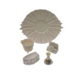 A Belleek porcelain boat shaped pipe rest, decorated with stylised waved, printed mark in black to