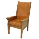 A Robert 'Mouseman' Thompson oak smokers chair, with a tanned leather back and cushion, on square