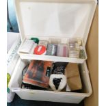 A plastic toolbox, containing a quantity of engraving equipment, including electric rotary tools,