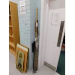 A small quantity of golf clubs, together with simulated bamboo wooden frame surrounds.