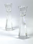 A pair of contemporary stylish heavy glass candlesticks