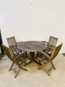 A weathered hardwood 'Canterbury Collection' patio set